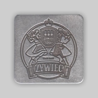 emblemat do galanterii; mocowanie za pomocą nitów; wykończenie w kolorze patynowanego srebra