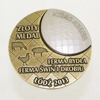 medal odlewany; wykończenie w kolorze patynowanego mosiądzu oraz półmatowego srebra