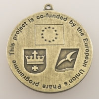 medal odlewany; wykończenie w kolorze patynowanego mosiądzu; średnica 50mm