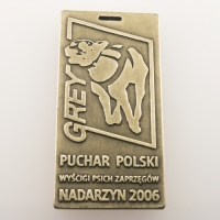 medal odlewany; wykończenie w kolorze patynowanego mosiądzu; wymiary 45 x 90 mm